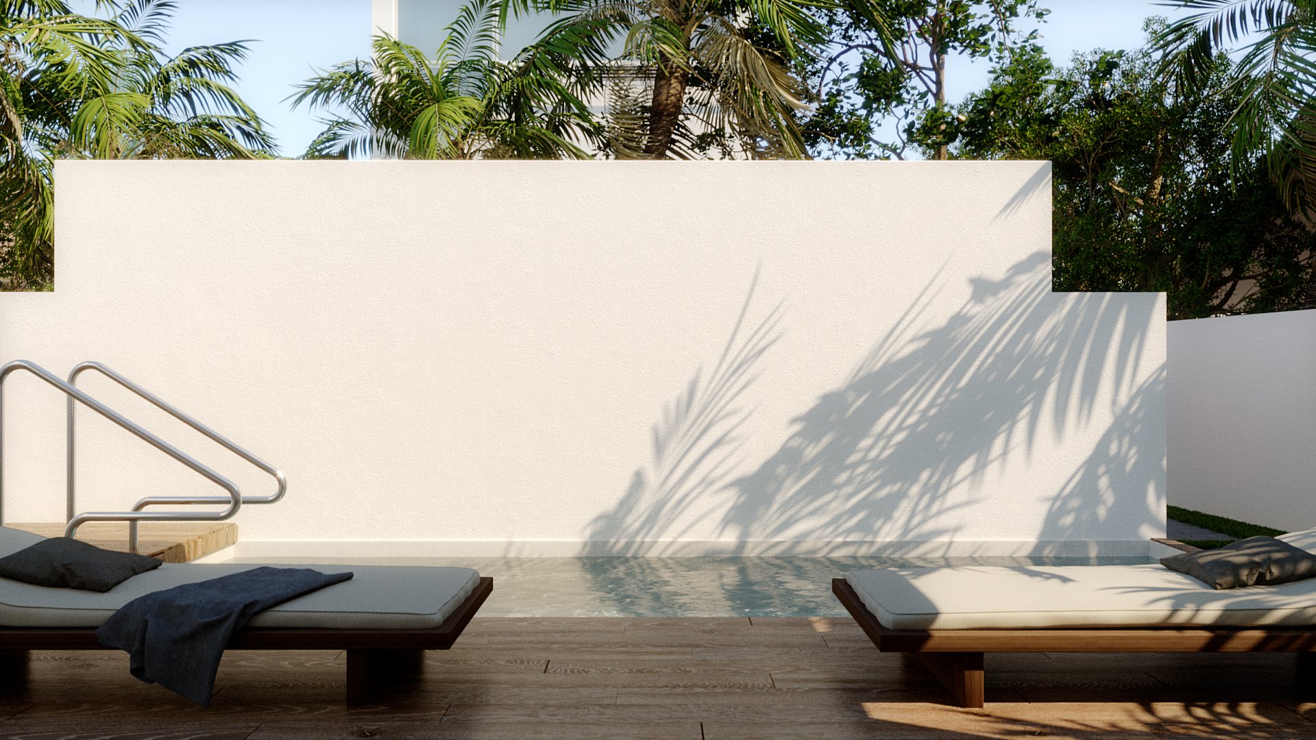 Nyla Court pool deck: two timber loungers with pale cushions and grey towels face a white stepped privacy wall across the pool edge, palm shadows thrown large across the render and palms rising behind the wall