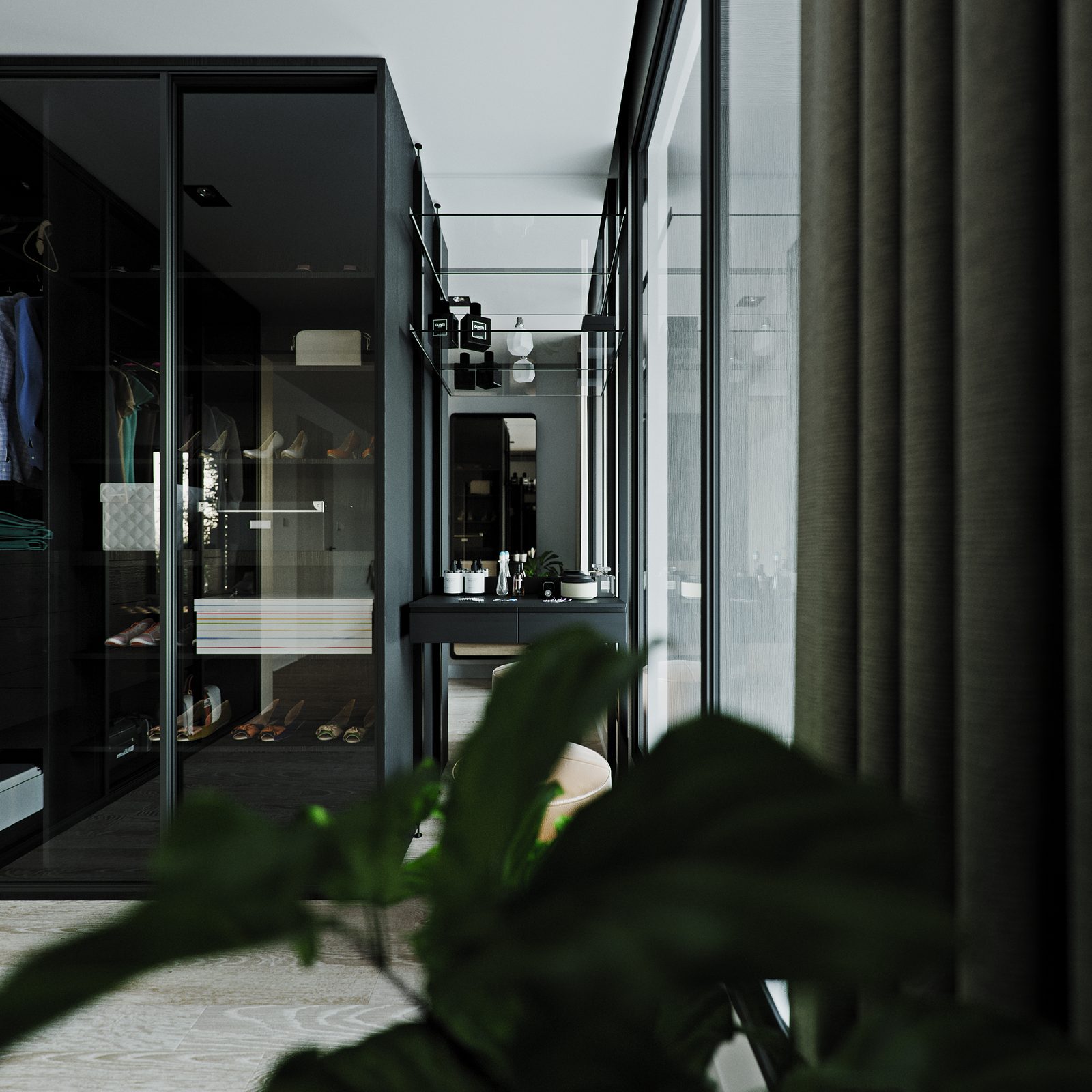 The black wardrobe run at the head of the bed, plant in the foreground.