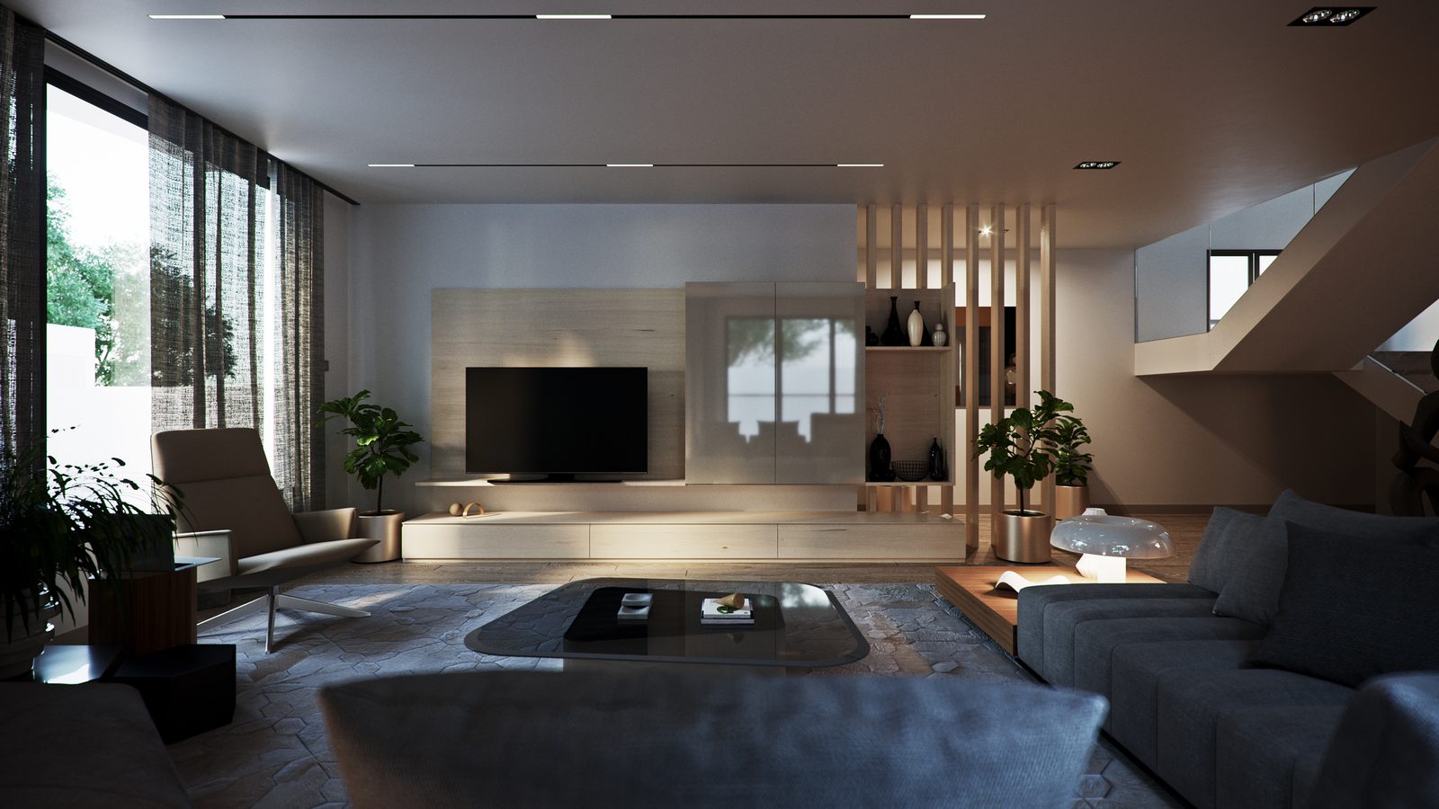 Sunken lounge with grey modular sofas, a low hearth and the media wall lit against the dusk glazing.