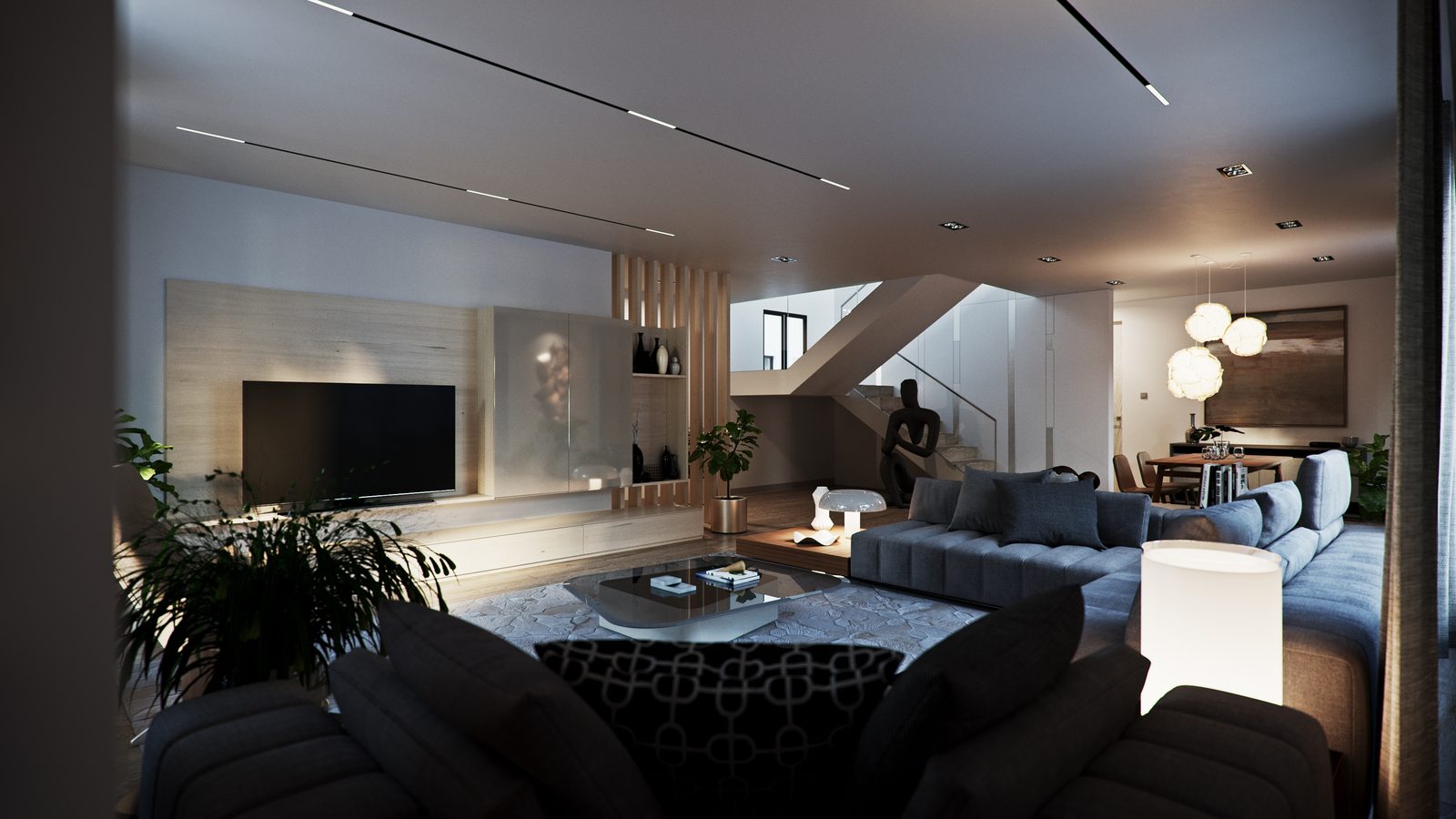The lounge from the far end, showing the slatted screen, the plantings and the stair rising behind the sofa.