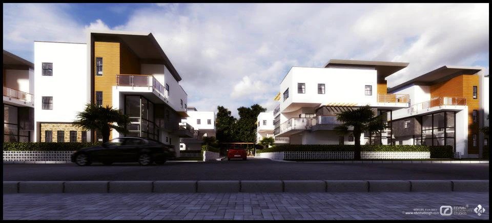 Street-view visualization of the blocks: white cubic volumes with yellow and orange end walls, recessed balconies, palm planting behind a low fence, two cars parked at the kerb and a broad paved foreground.