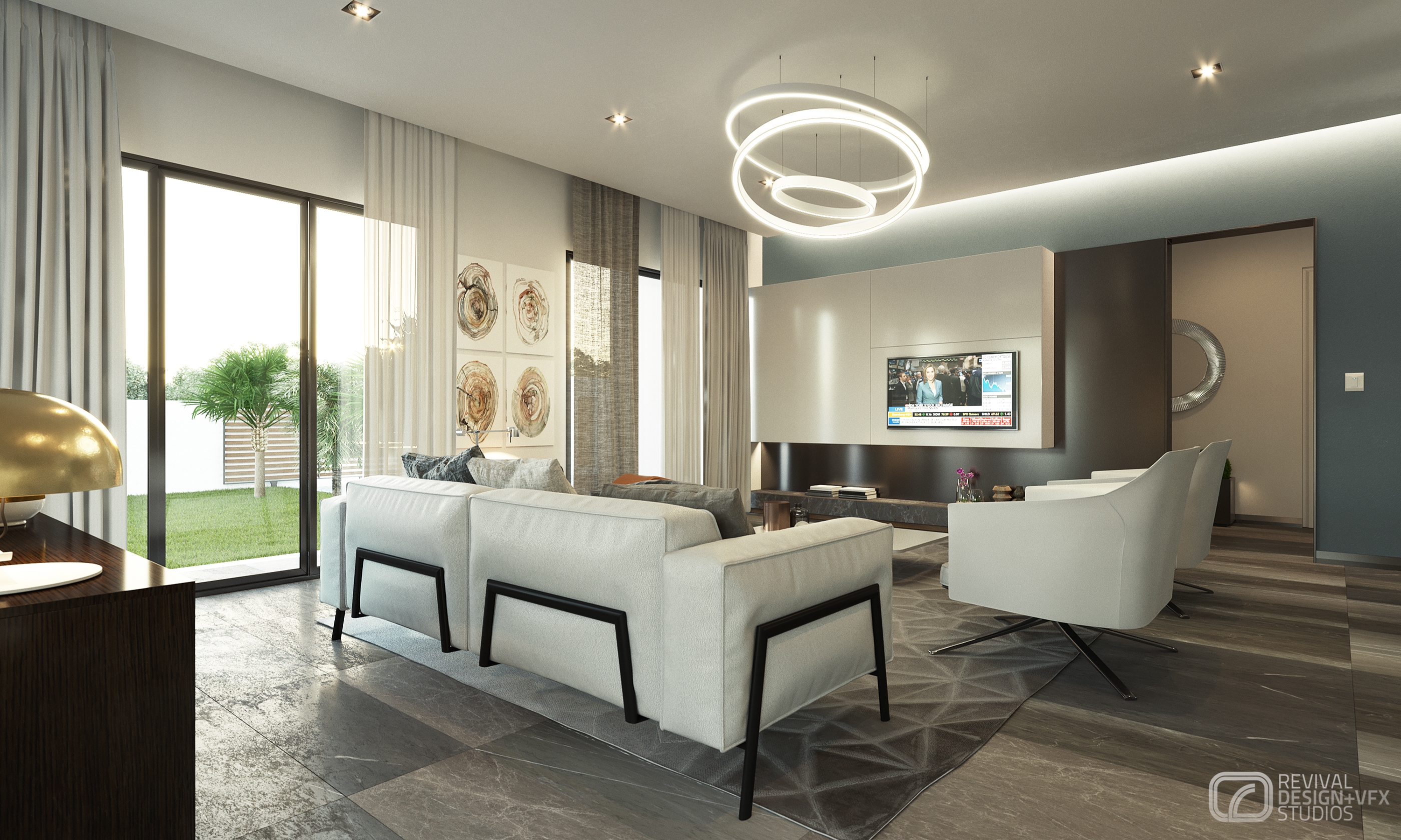 Petrus living room from behind the sofas: a wall-mounted television over the cream media panel, two white swivel chairs and the ring chandelier, tree-ring artworks and a sliding door to the lawn beyond.