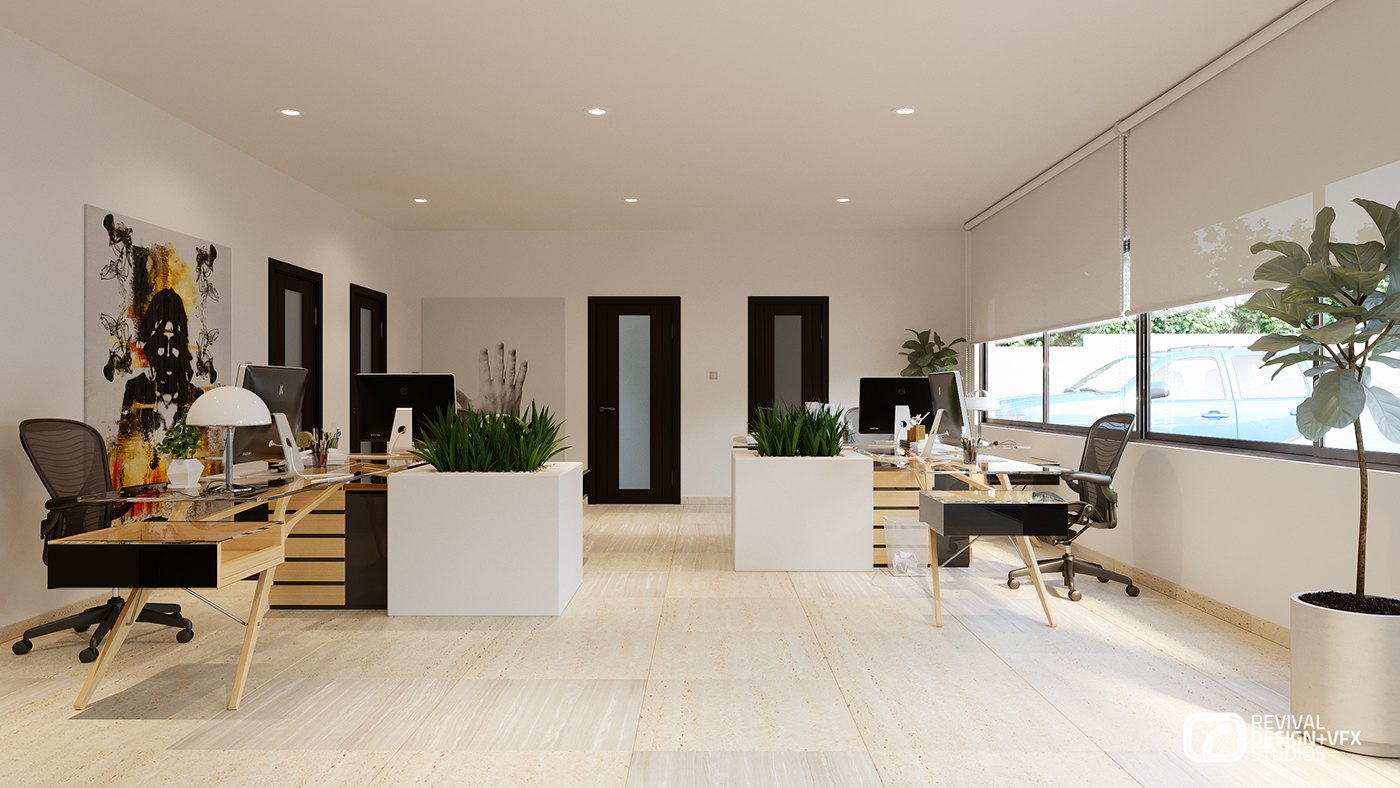 Second open-plan view: desks divided by low white planters of grass, dark doors along the back wall, a potted tree at the right and framed art above the workstations.