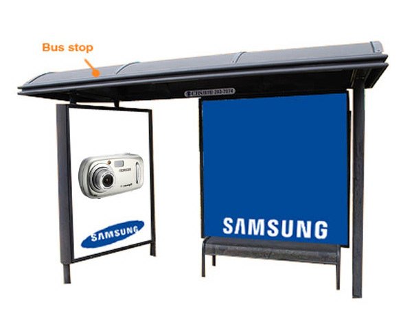 Concept mockup on white: a bus shelter labeled Bus stop in orange, its side panel carrying a compact camera poster and the blue Samsung wordmark on the main advertising bay.