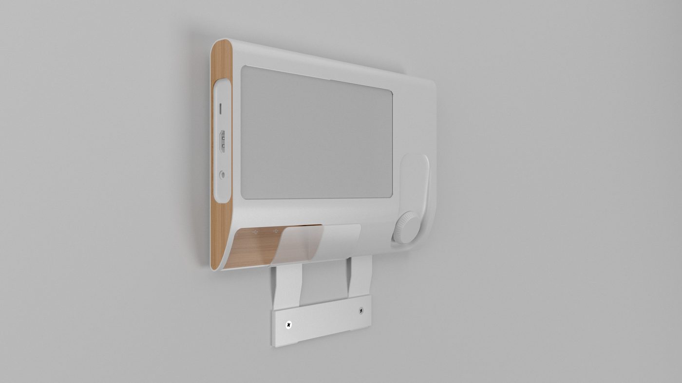 The panel clipped to a white steel wall bracket, showing how the unit hangs on the plate and the cable drops clear behind it.