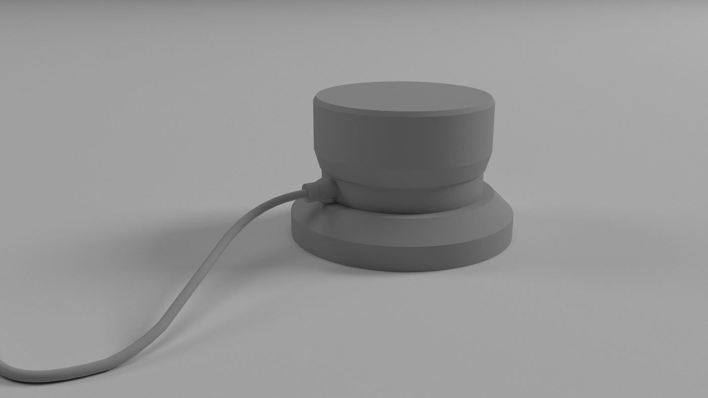 The rotary dial as a separate part: a turned cylinder on a short captive cable, rendered in clay against a grey ground.