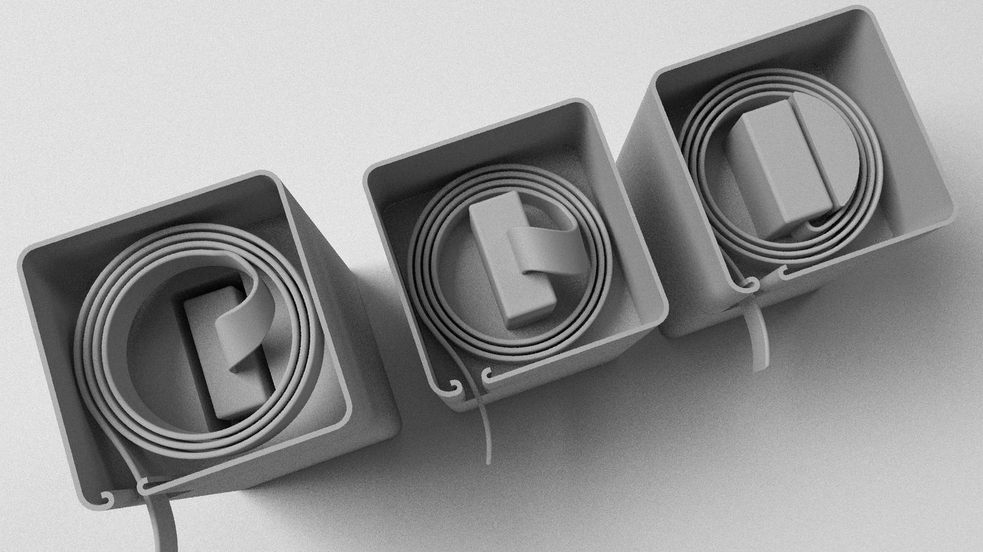 Three square cable boxes in a row, each holding a coiled flat cable wound round a moulded clip.