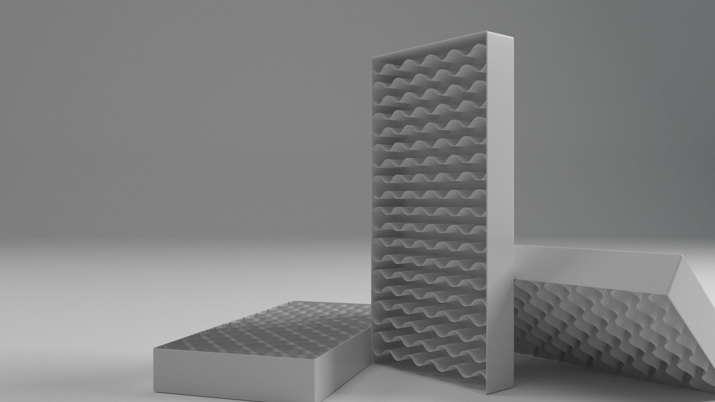 The primary tray stood on its edge with the dimpled liner and the end cap arranged around it, showing how the parts nest.