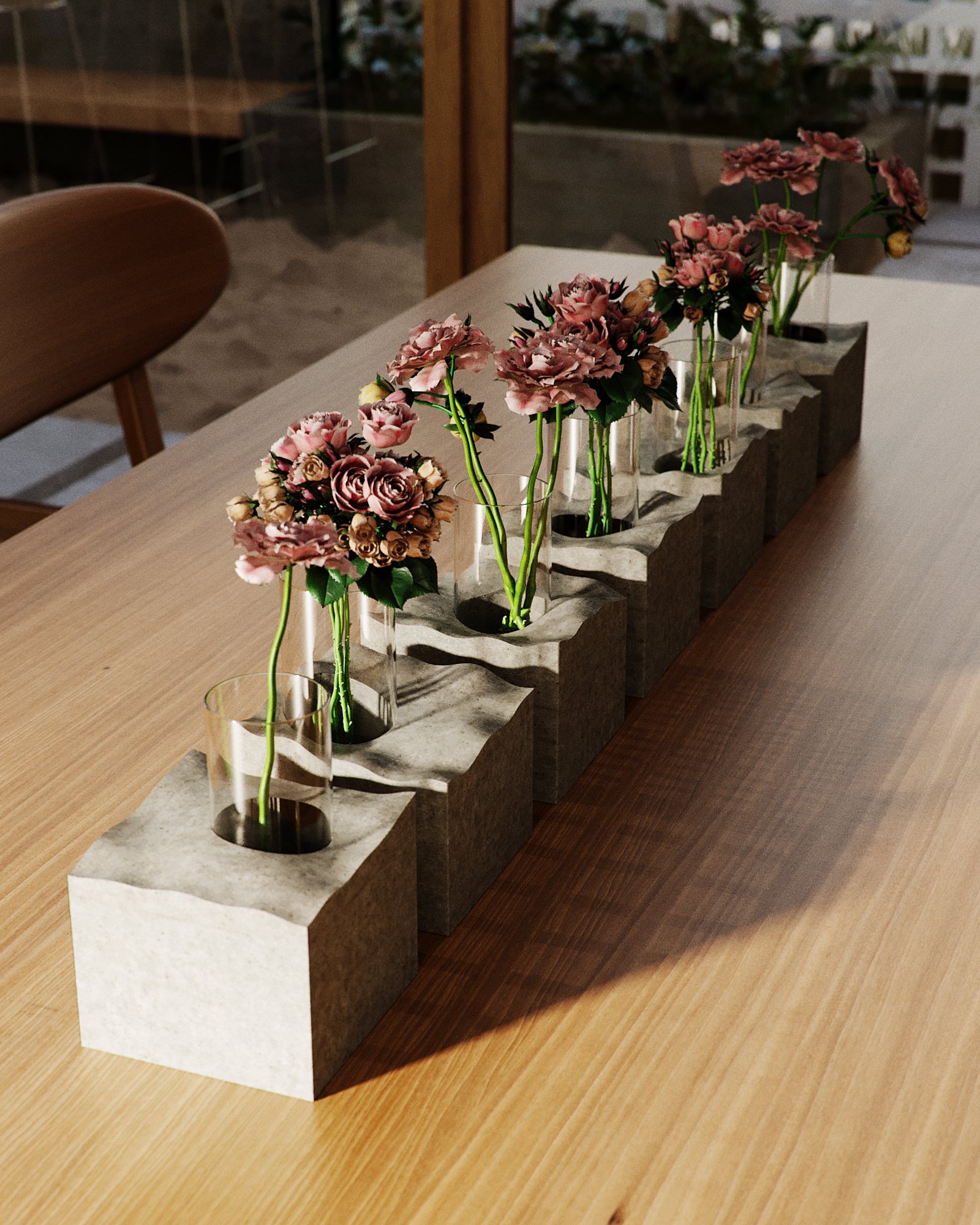 Drilled concrete table runner holding glass cylinders of roses and protea