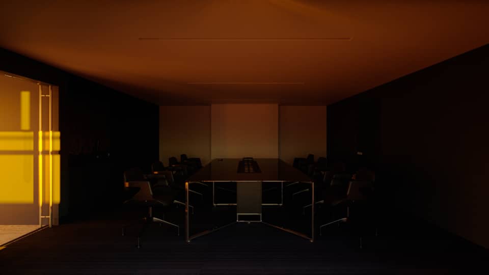 The Fitzgerald boardroom from the opposite end under the same amber wash, a bright orange window panel at left and a thin ceiling slit above the dark table and its ring of chairs.