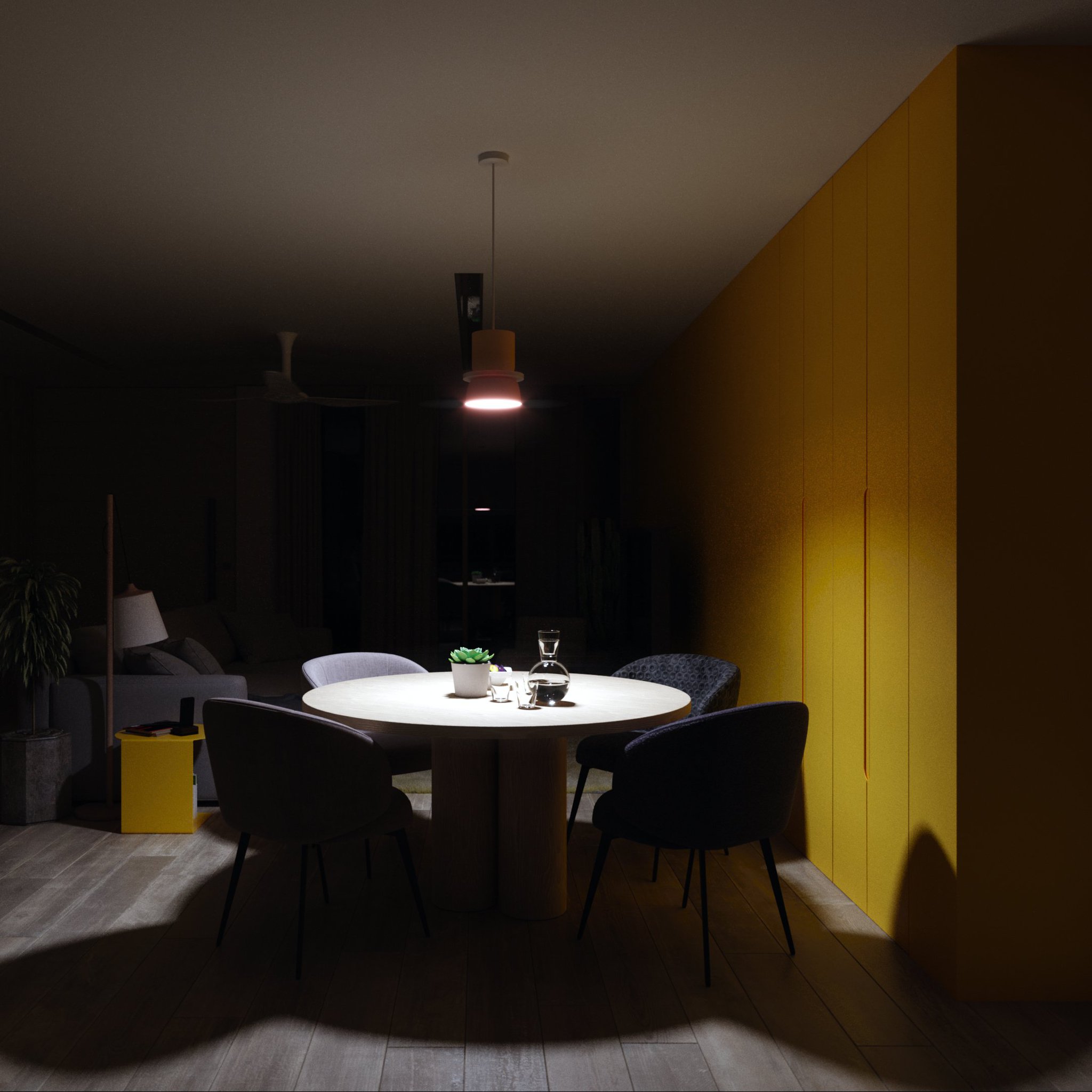 TTD dining area at night: round oak table spotlit by a single pendant against a mustard wall, four chairs, carafe and succulent, yellow side table.