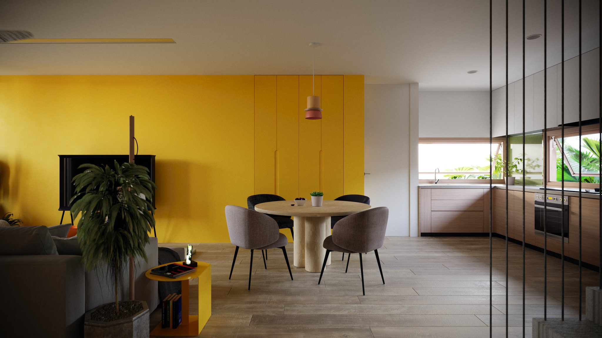TTD the same room by day: yellow wall and cabinets, round oak table with four chairs, red pendant, black TV, potted palm and a pale wood kitchen.