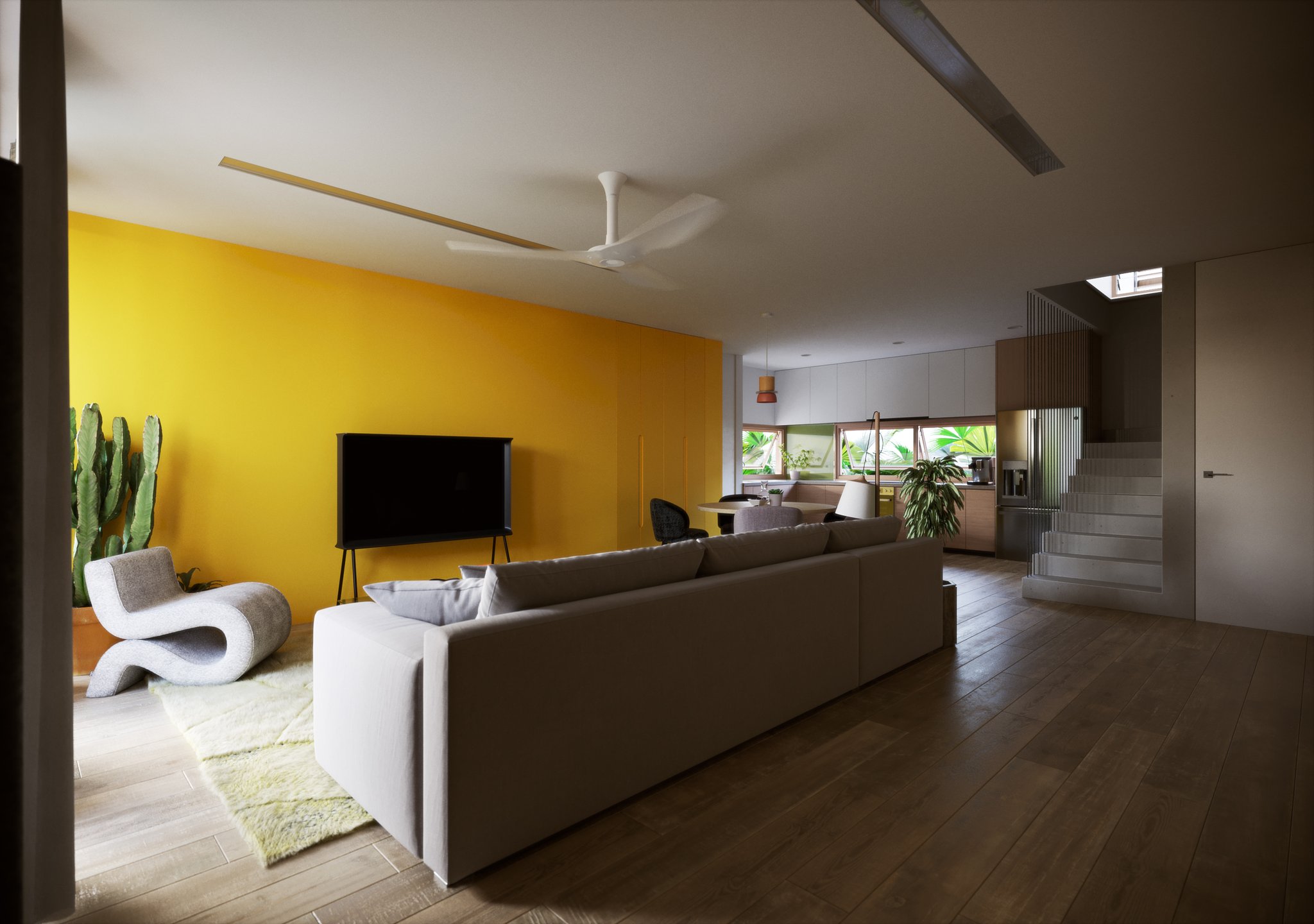 TTD living room by day from the doorway: yellow accent wall, TV on a black stand, grey sofa seen from behind, white S-shaped chair and a potted cactus.
