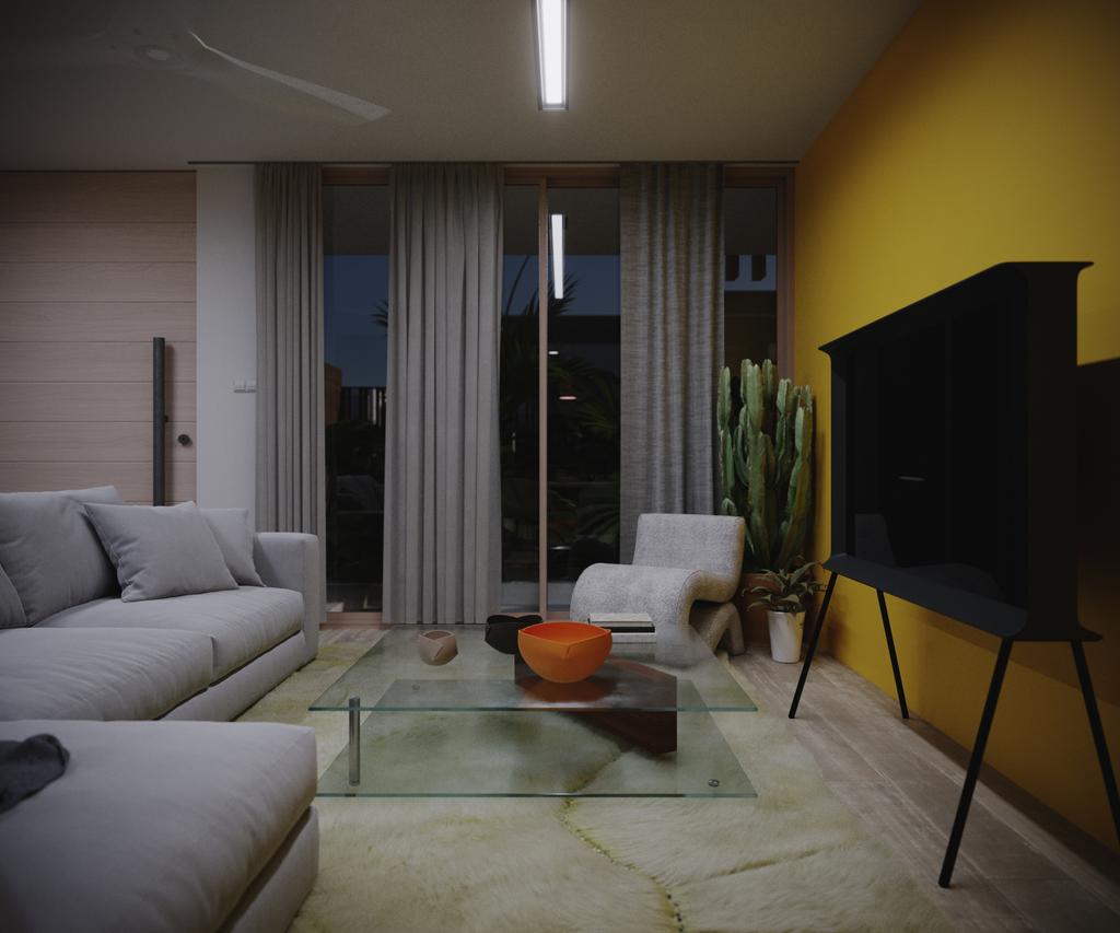 TTD the same sofa-end view at night: ceiling light strip on, dark glass doors outside, cactus and white S-chair by the window.