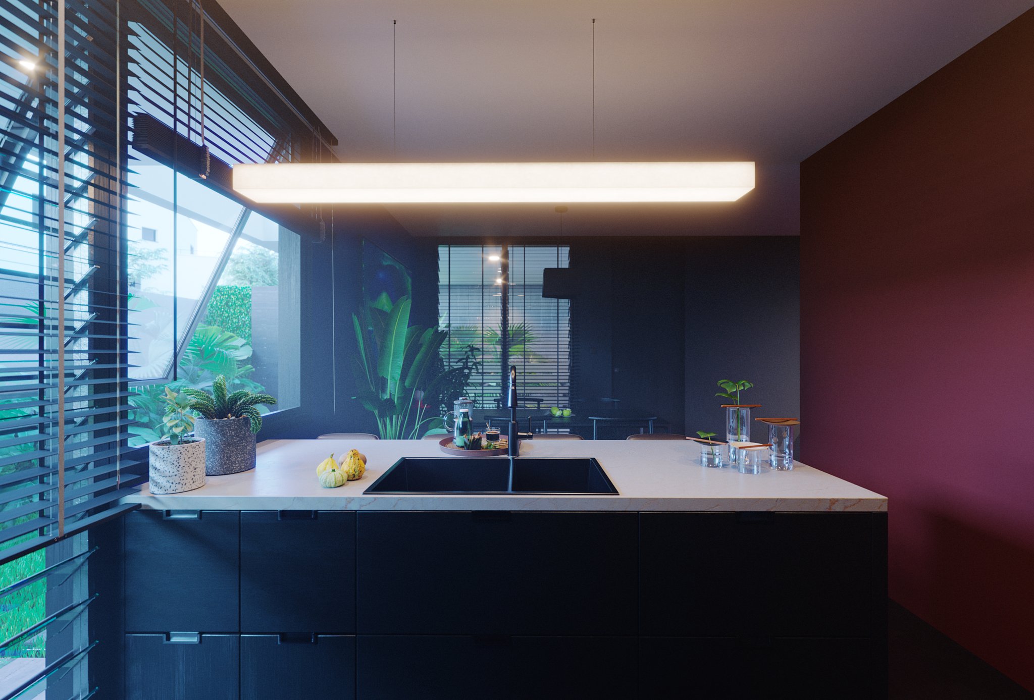 TTD kitchen island at dusk: black base cabinets under a white marble top, black double sink, tall chrome tap, long linear pendant, oxblood wall at the right.
