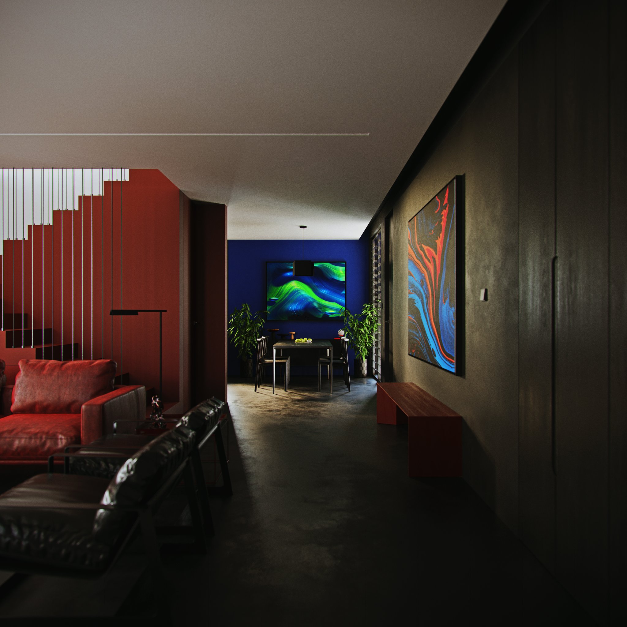 TTD night view down a bare concrete hall to the dining nook: red stair at the left, blue and orange canvas over a red bench on the right.
