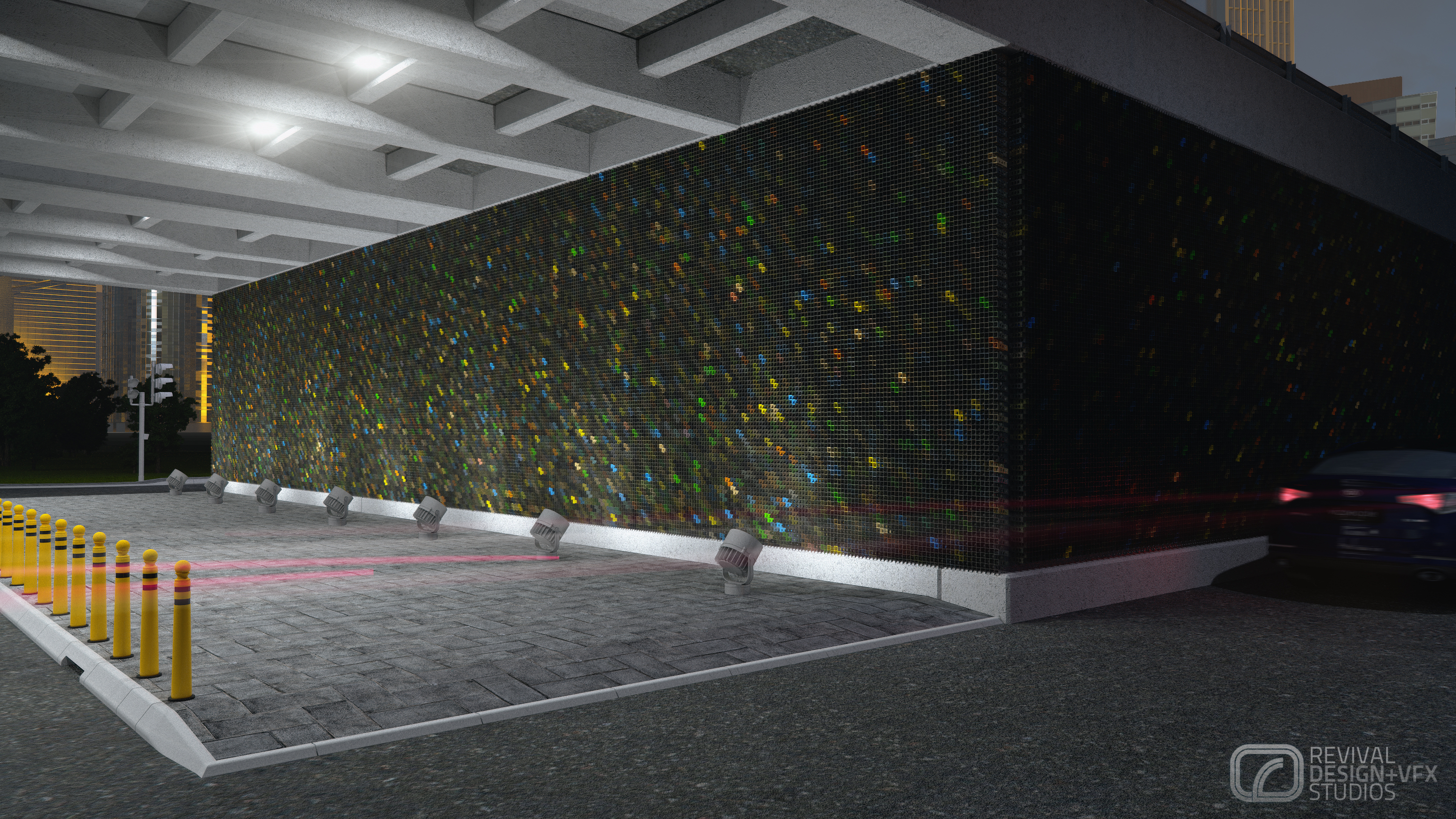 Night view of the clad wall under a coffered concrete deck: dark perforated panels scattered with small multicolour chips run the length of the frame, lit by a row of ground uplighters, with yellow flexible bollards on the paved forecourt at left and a car's red light trails at right.